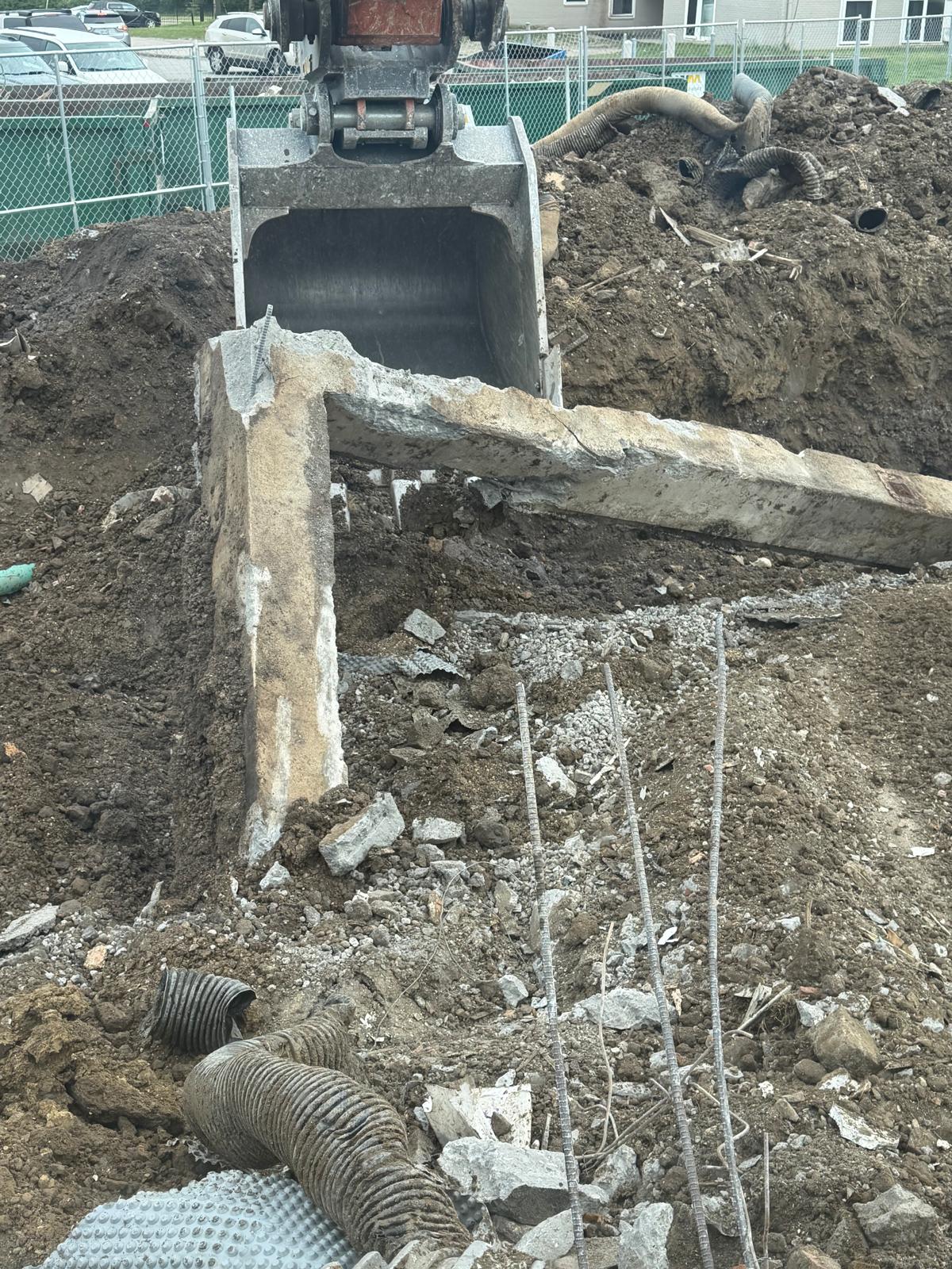 Excavator working on demolition site